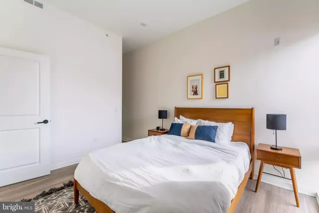 a bedroom with a bed and a table