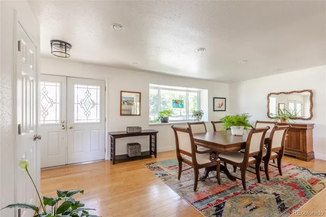 a view of a dining room with furniture and a window