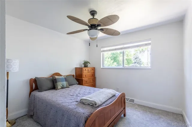 a bed room with a bed and a window