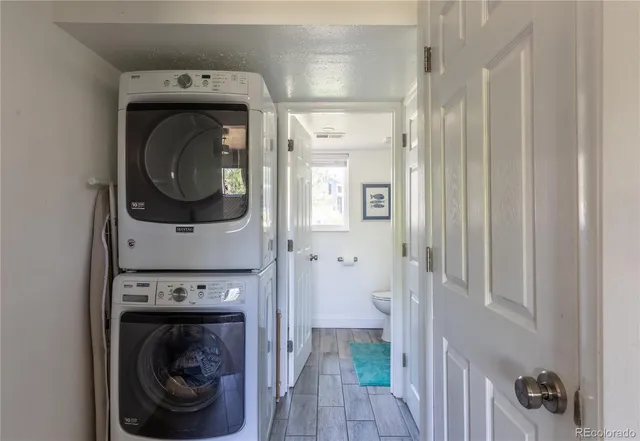 a view of a hallway with washer and dryer