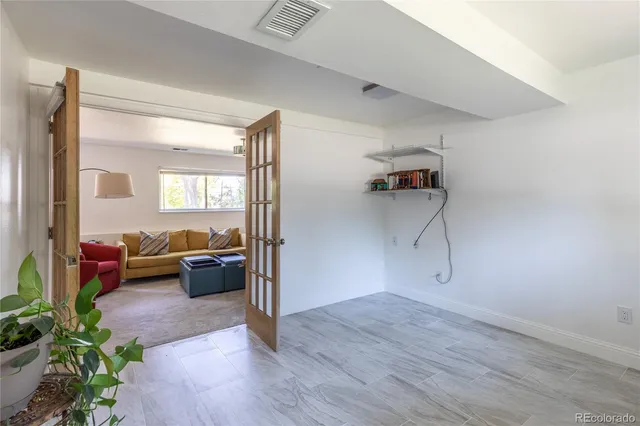 a view of a backyard with a tree