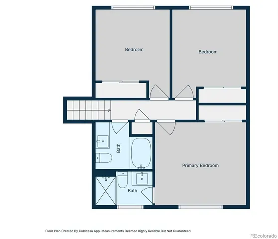 a picture of a room with a white wall and a refrigerator