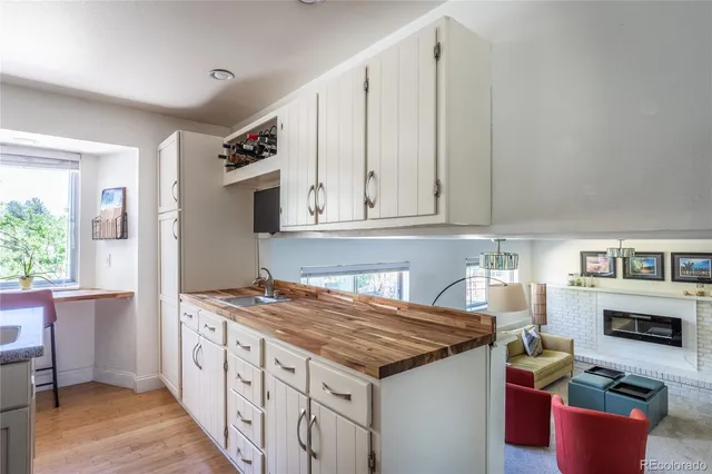 a kitchen with stainless steel appliances granite countertop a stove and a refrigerator