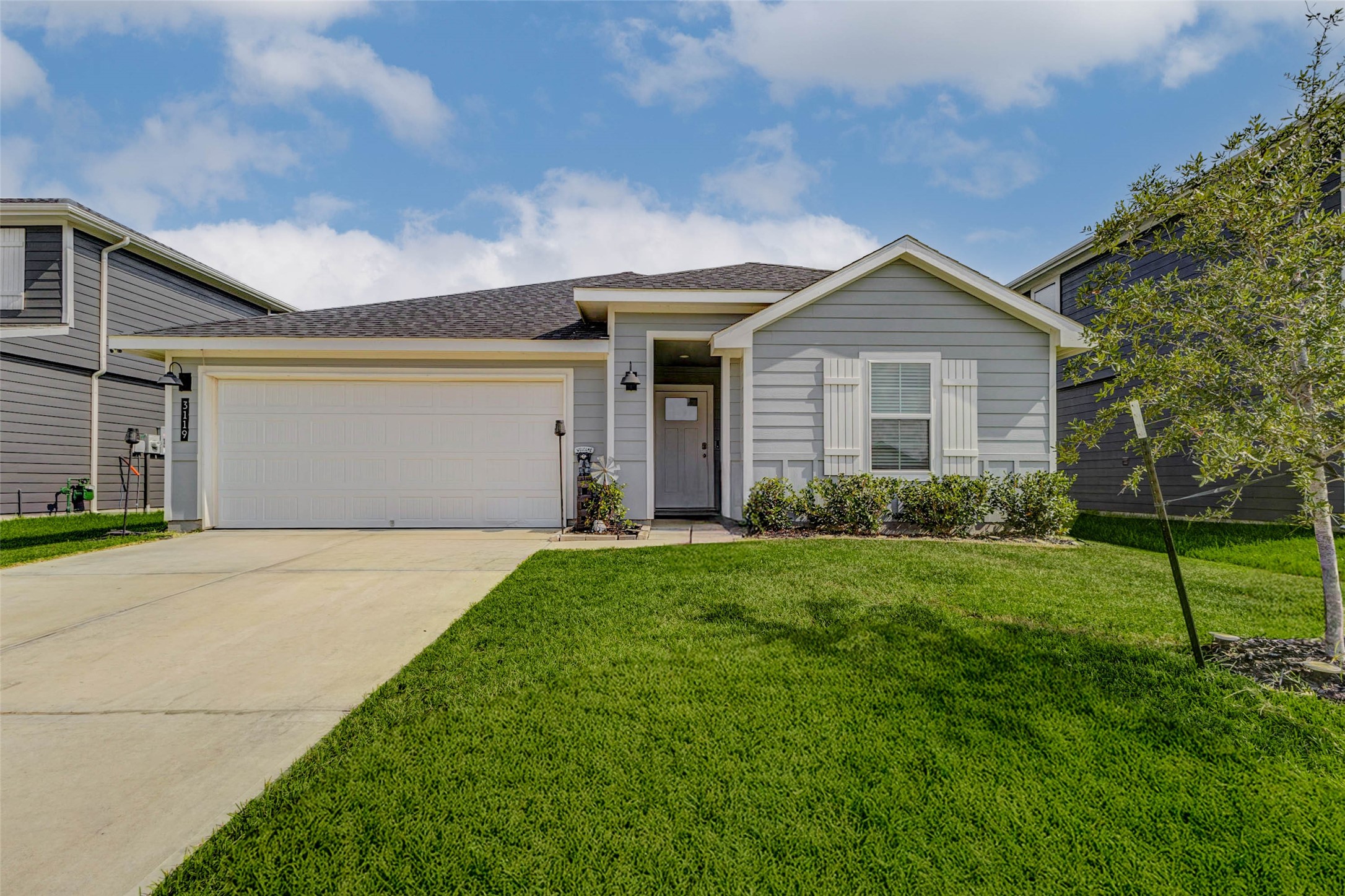 a front view of house with yard and green space