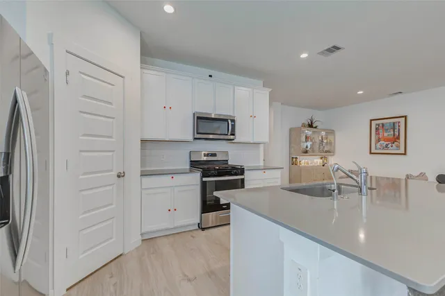 a view of a house with backyard and porch
