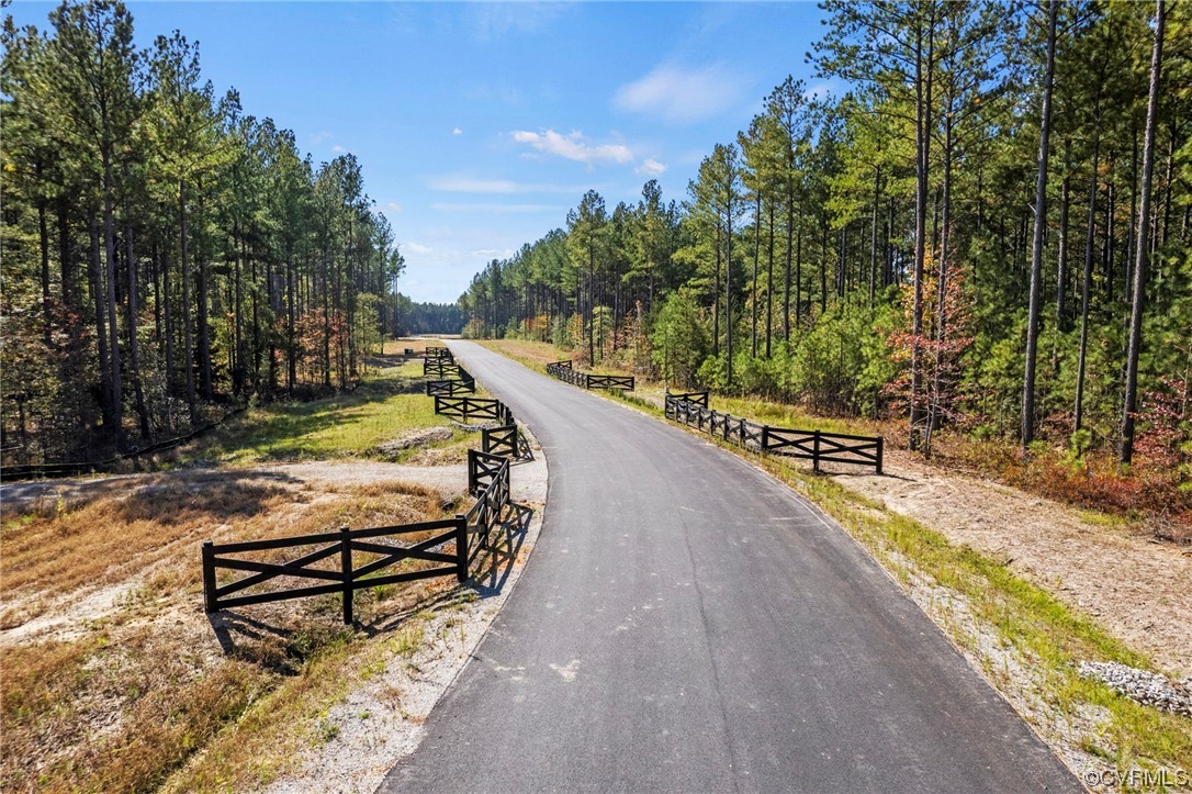 1120 Cardinal Crest Terrace Midlothian, VA 23113 - Photo 4 of 6 a view of a swimming pool with a bench and trees around