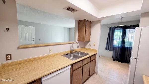 a bathroom with a sink a vanity and a mirror