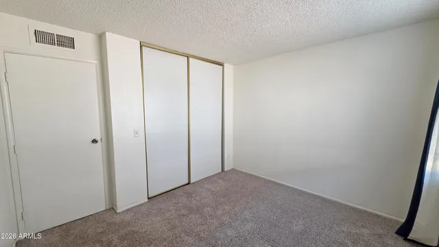 a bathroom with a sink mirror vanity and toilet