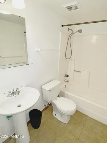 a view of a park with swings and slides