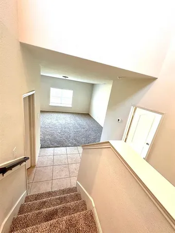 a view of a living room with a rug