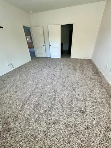 an empty room with wooden floor