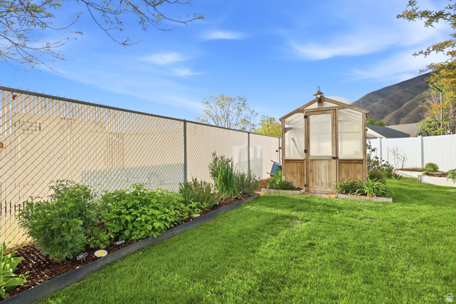 1816 River Bottom Road Springville, UT 84663 - Photo 32 of 37 Greenhouse structure with wood-finish framing and translucent panels