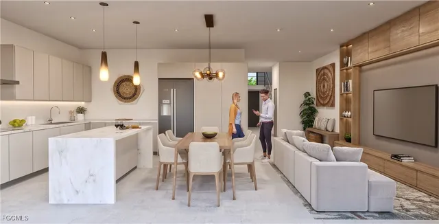 a large kitchen with a table chairs and a refrigerator