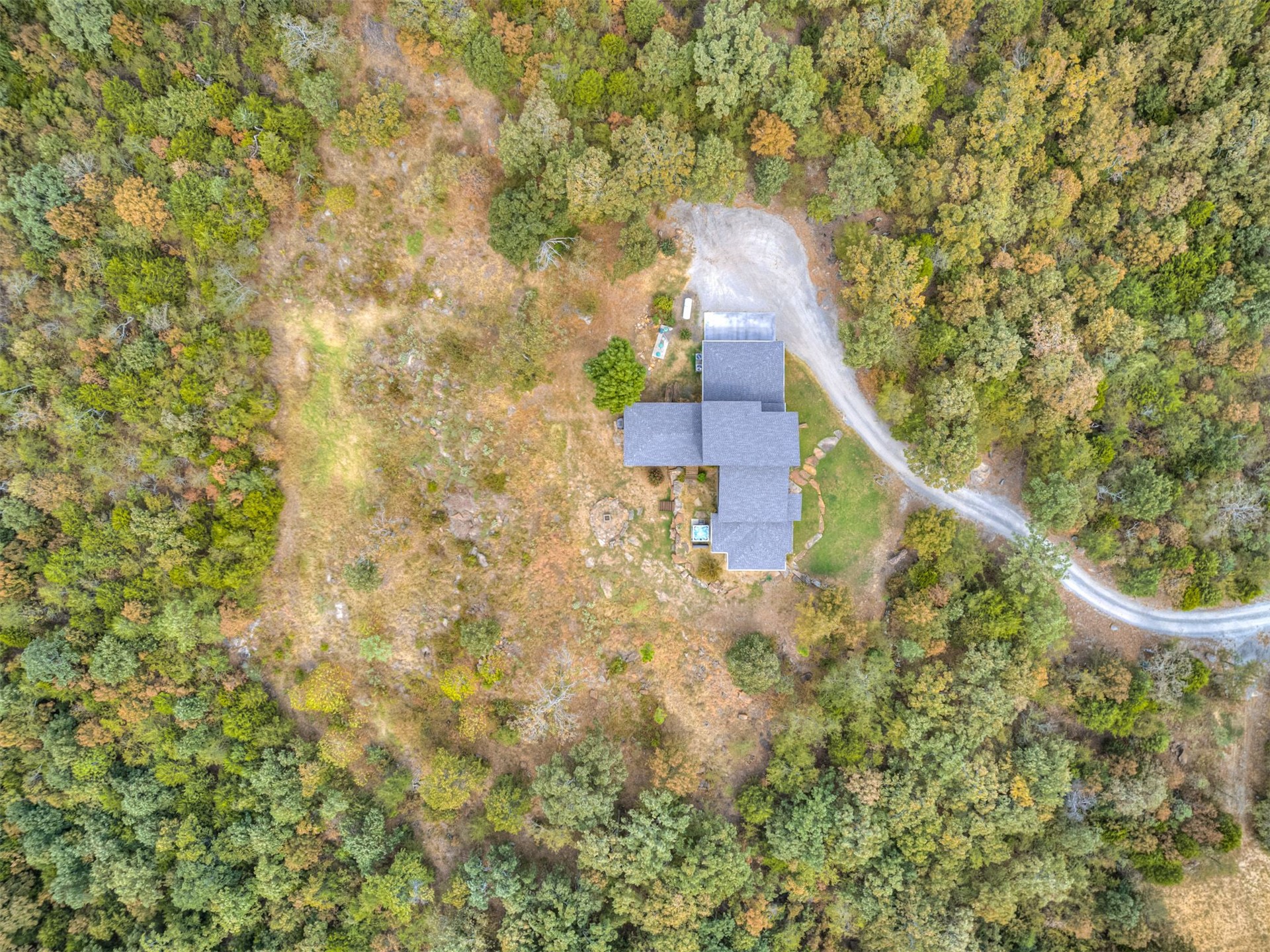 1073 Hidden Ridge Road Stigler, OK 74462 - Photo 50 of 56 Expansive property featuring a gravel driveway, mature trees, and natural landscaping