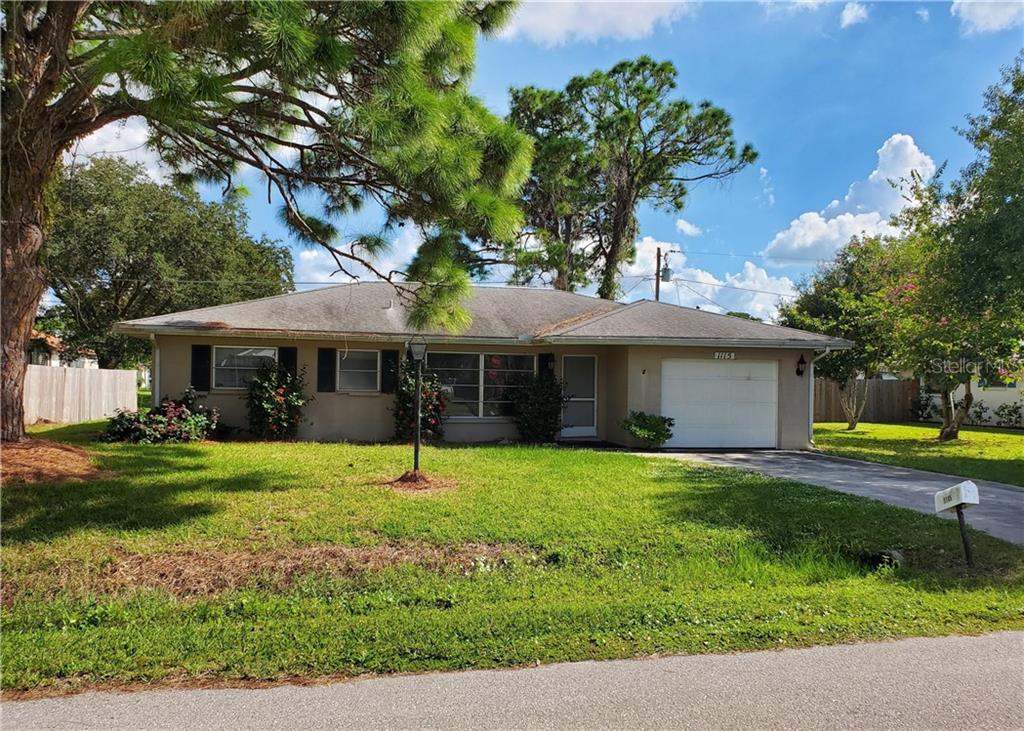 1115 Ringtail Road Venice, FL 34293 - Photo 1 of 1 a front view of a house with garden