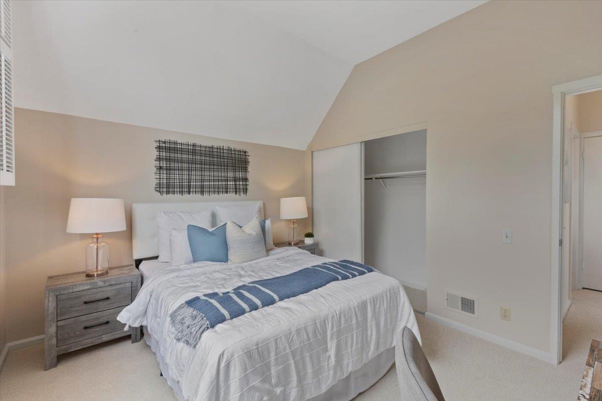 4 Farm Road Los Altos, CA 94024 - Photo 18 of 44 a bedroom with a bed and a lamp