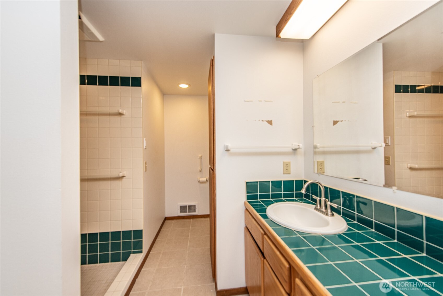 72 Skunk Hollow Road Sequim, WA 98382 - Photo 17 of 40 a bathroom with a sink and a mirror