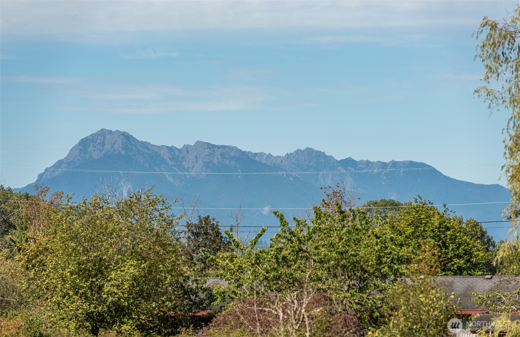 72 Skunk Hollow Road Sequim, WA 98382 - Photo 32 of 40 a view of a lake with a mountain in the background