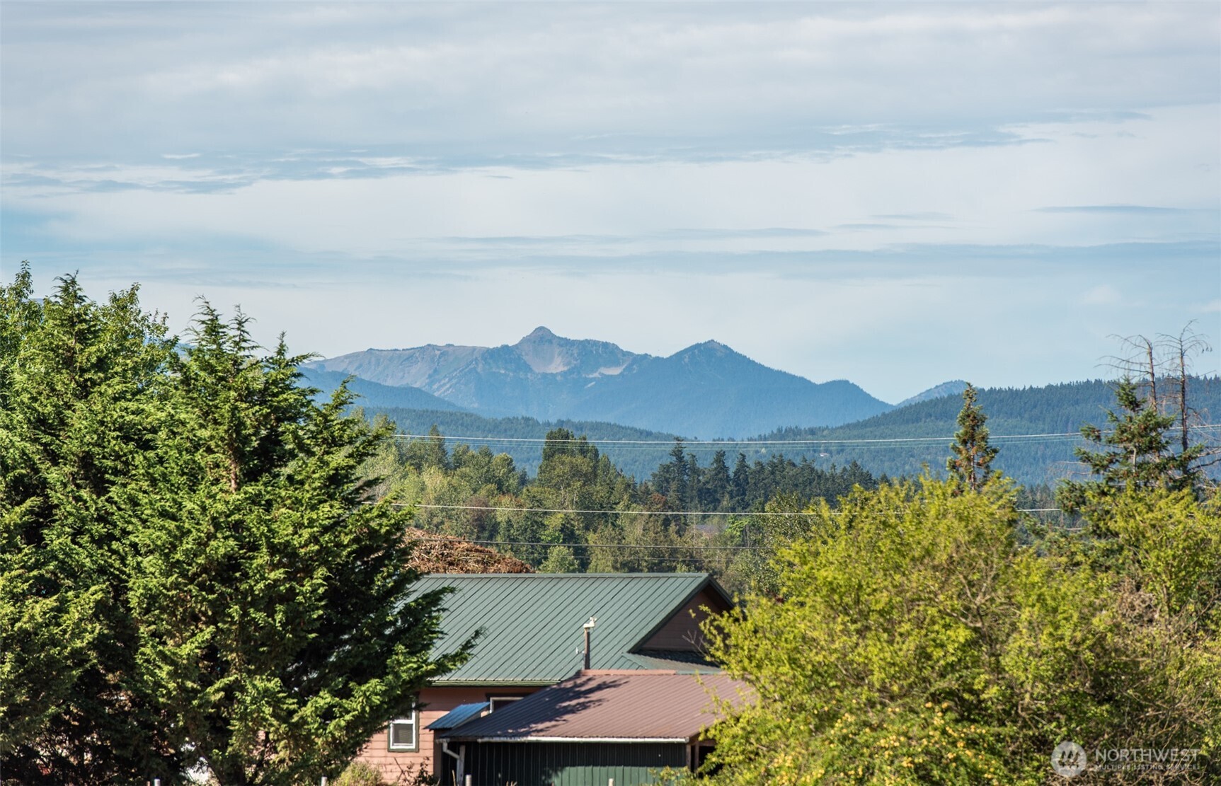 72 Skunk Hollow Road Sequim, WA 98382 - Photo 33 of 40 an aerial view of a house with mountain view