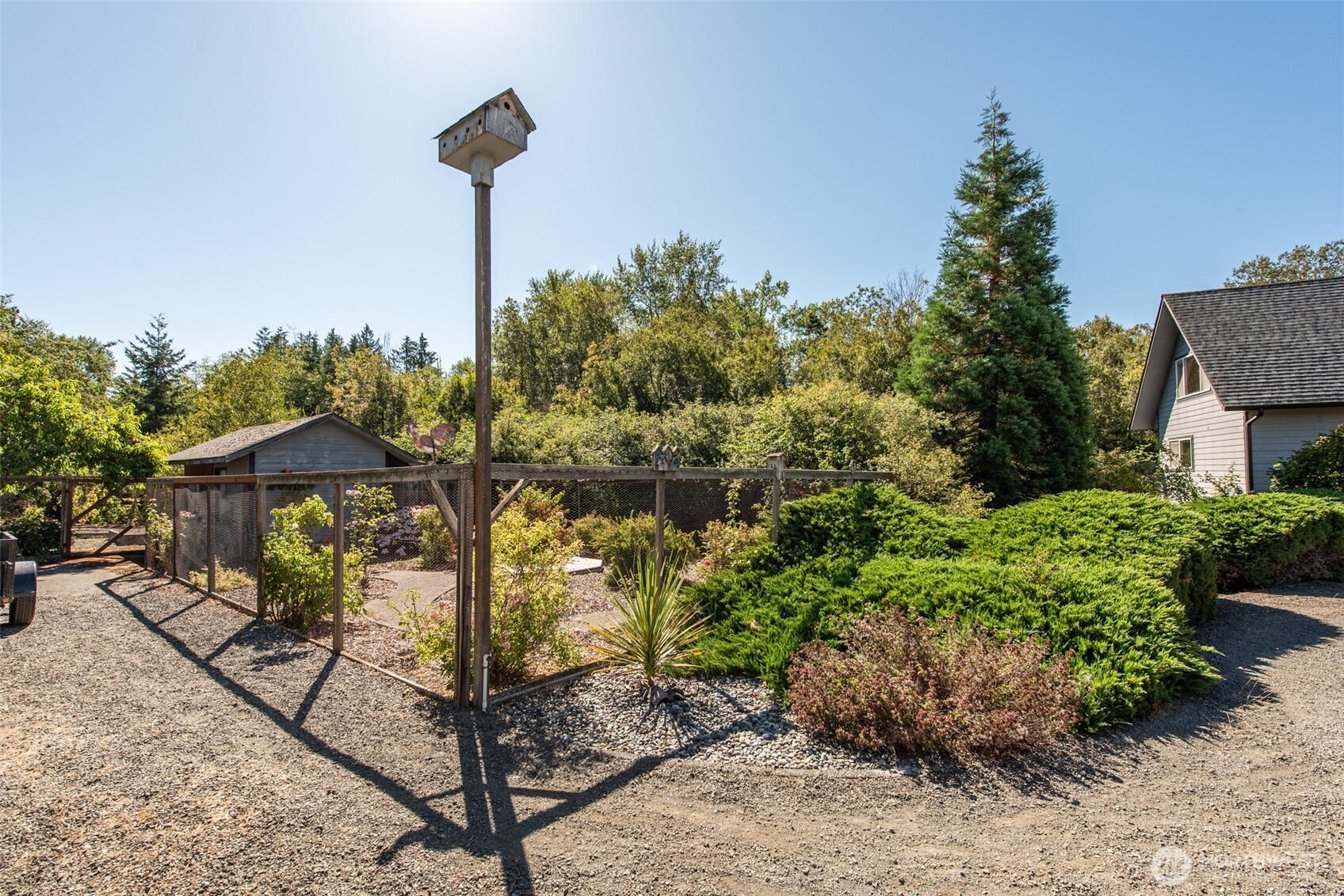 72 Skunk Hollow Road Sequim, WA 98382 - Photo 34 of 40 a front view of a house with garden