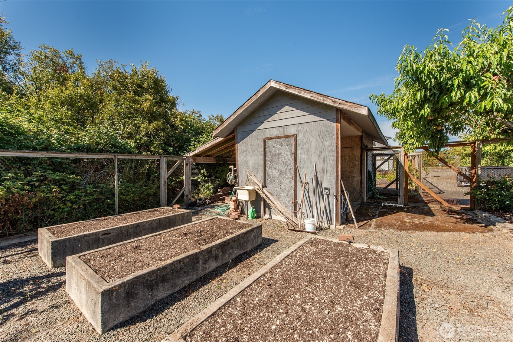 72 Skunk Hollow Road Sequim, WA 98382 - Photo 37 of 40 a view of a roof deck with wooden fence and a couple of chairs