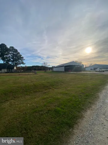 a view of a lake with houses in the back