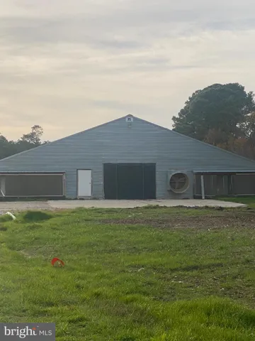 a front view of a house with a lake view