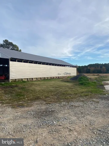 a view of walk in closet with clothes