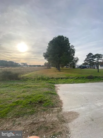 a view of a lake with houses in the back
