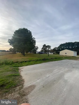 a view of a lake with houses in the back
