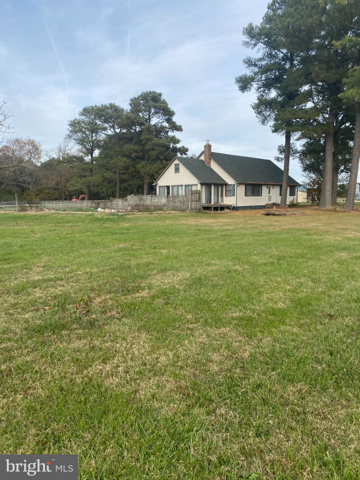 27160 Cash Corner Road Crisfield, MD 21817 - Photo 52 of 62 a front view of a house with a garden and trees