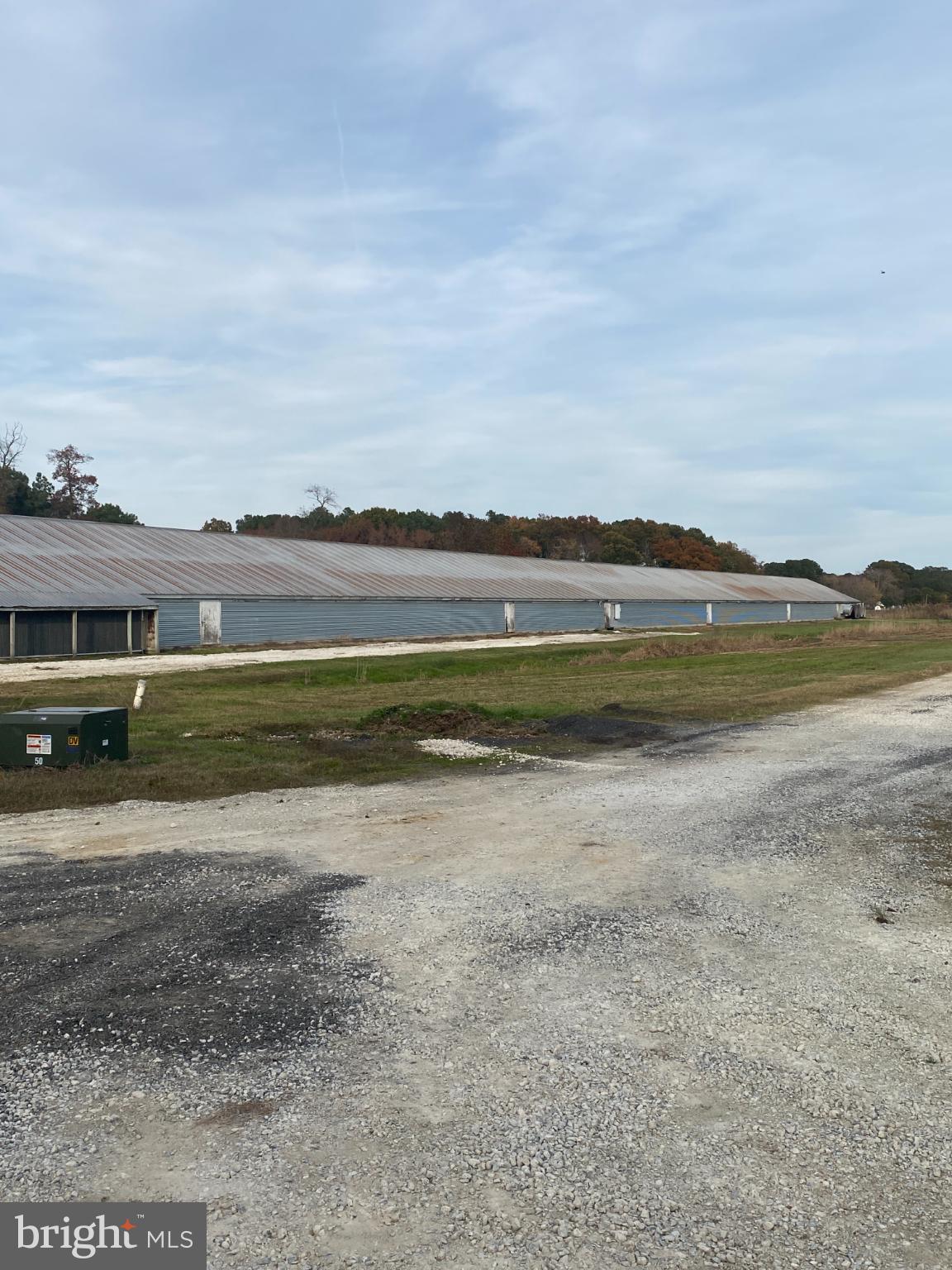 27160 Cash Corner Road Crisfield, MD 21817 - Photo 7 of 62 a view of a lake with houses in the back