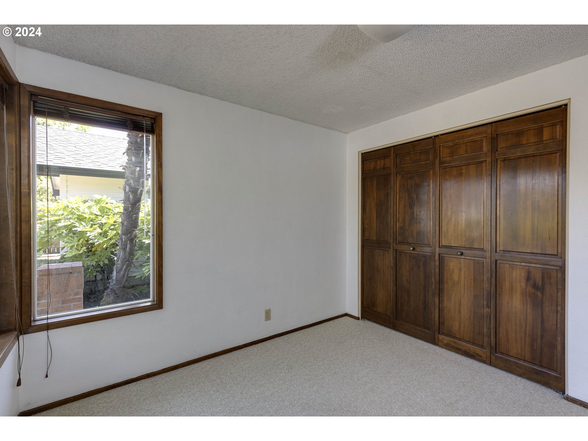 2466 Erin Way Eugene, OR 97408 - Photo 23 of 31 a view of an empty room with a window