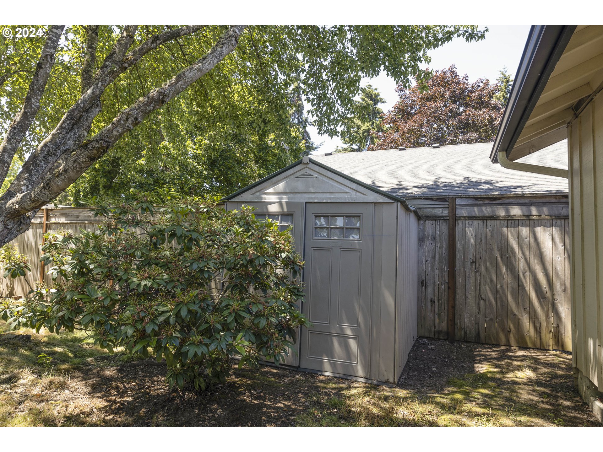 2466 Erin Way Eugene, OR 97408 - Photo 30 of 31 a house with a tree in front of it
