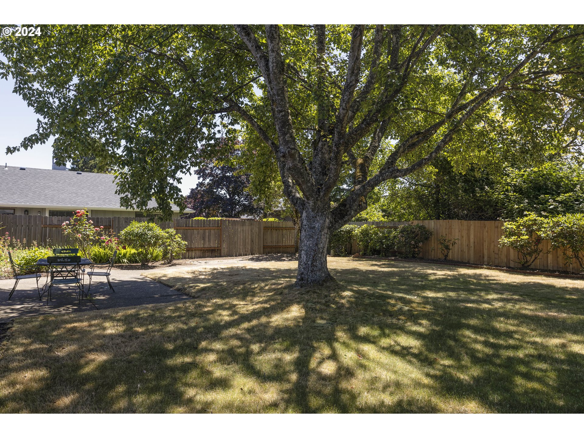 2466 Erin Way Eugene, OR 97408 - Photo 31 of 31 a backyard of a house with table and chairs