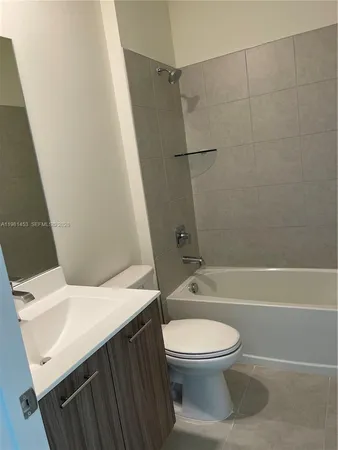 a bathroom with a sink a toilet and a bathtub