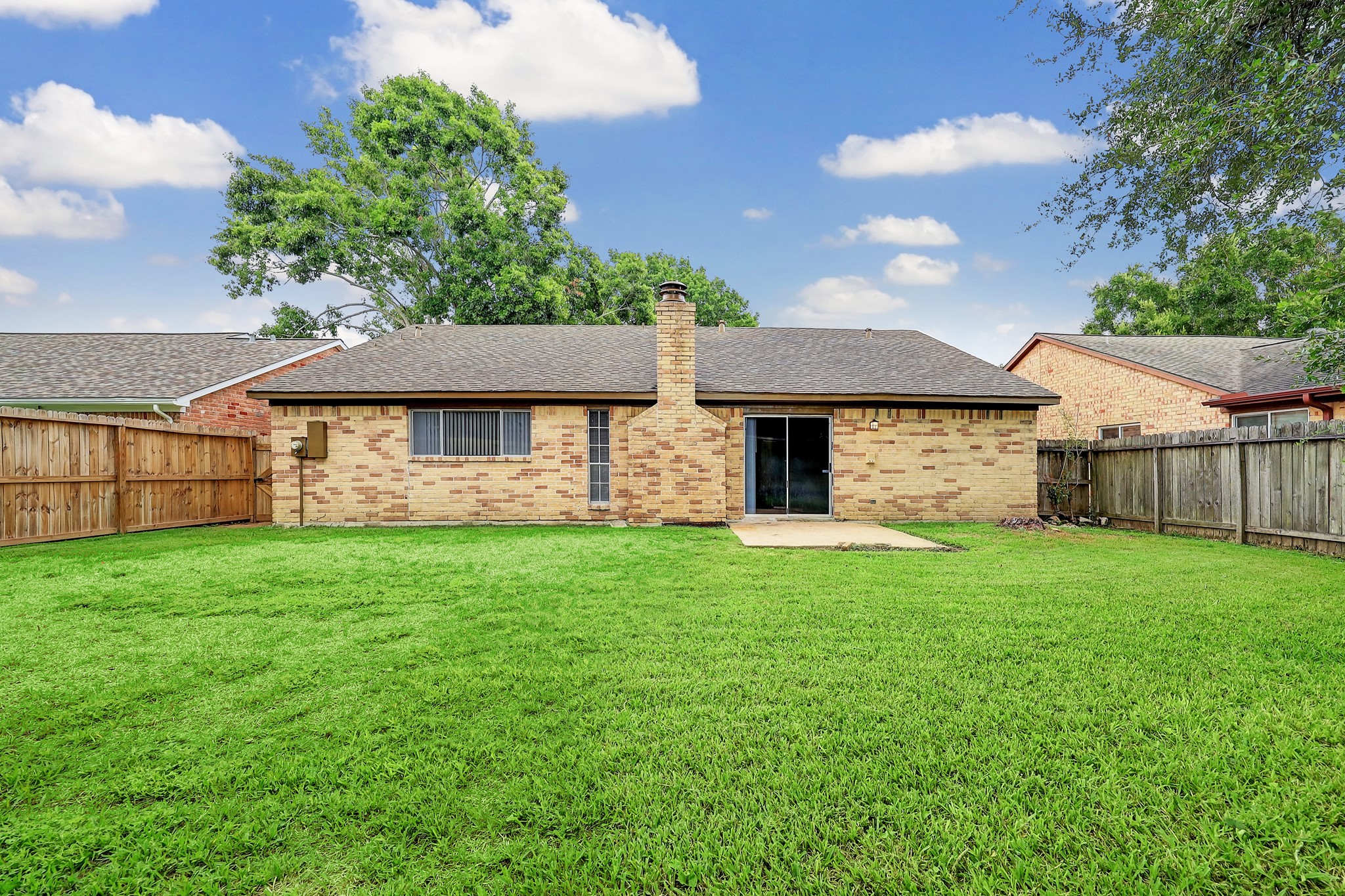 1906 Iron Ridge Sugar Land, TX 77478 - Photo 12 of 12 a front view of a house with a garden