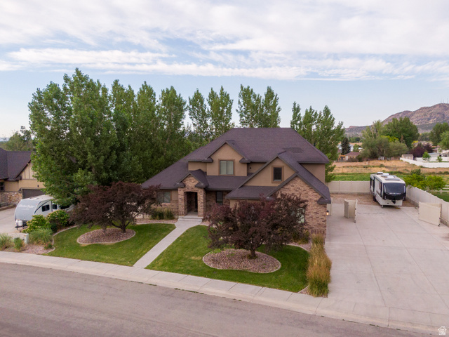 3565 West 1350th Street North Vernal, UT 84078 - Photo 3 of 54 Two-story property featuring a multi-toned exterior with brick and stucco accents