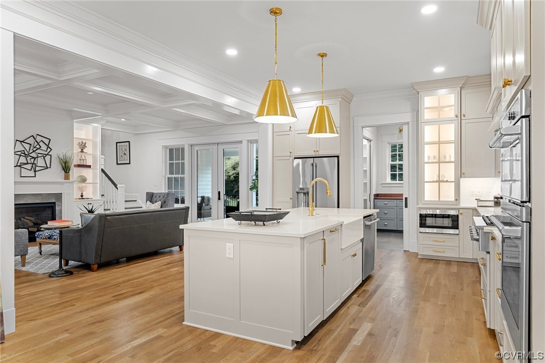 3611 Brook Road Richmond, VA 23227 - Photo 14 of 49 a large kitchen with stainless steel appliances kitchen island a large counter space a sink and living room view