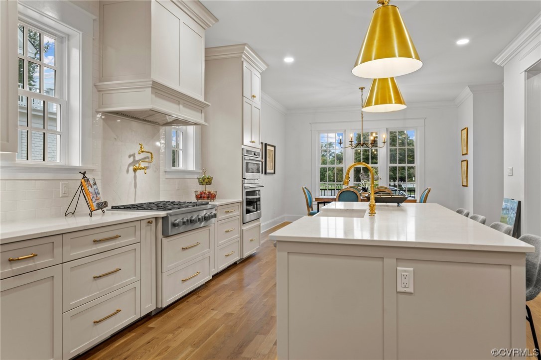 3611 Brook Road Richmond, VA 23227 - Photo 16 of 49 a kitchen with kitchen island granite countertop a sink a counter and a view of living room