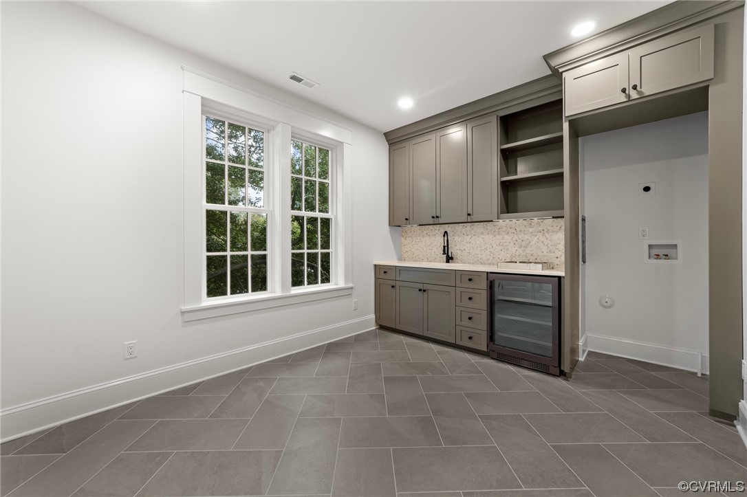 3611 Brook Road Richmond, VA 23227 - Photo 33 of 49 a large white kitchen with granite countertop a sink and a stove top oven