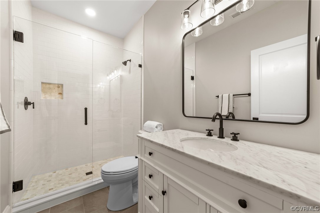 3611 Brook Road Richmond, VA 23227 - Photo 37 of 49 a bathroom with a sink a toilet and shower