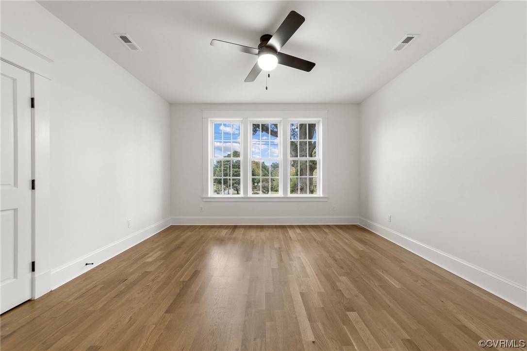 3611 Brook Road Richmond, VA 23227 - Photo 38 of 49 a view of an empty room with wooden floor and a window