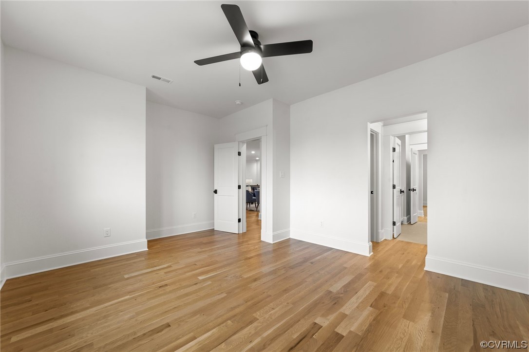3611 Brook Road Richmond, VA 23227 - Photo 40 of 49 an empty room with wooden floor and windows