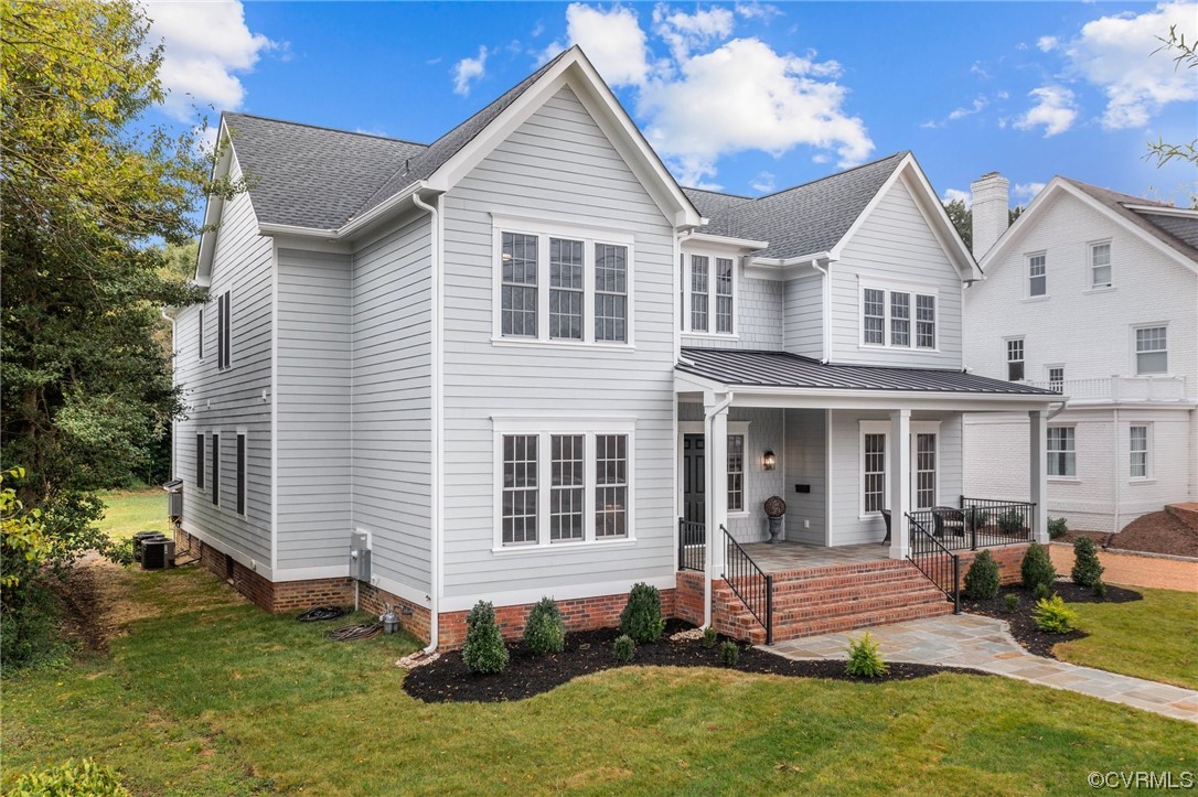 3611 Brook Road Richmond, VA 23227 - Photo 4 of 49 a front view of a house with a yard