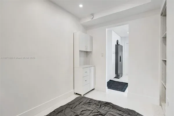 a bedroom with a bed and a cabinets