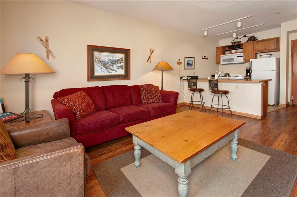 129 River Run Road, Unit 8058 Keystone, CO 80435 - Photo 11 of 35 a living room with furniture and a table