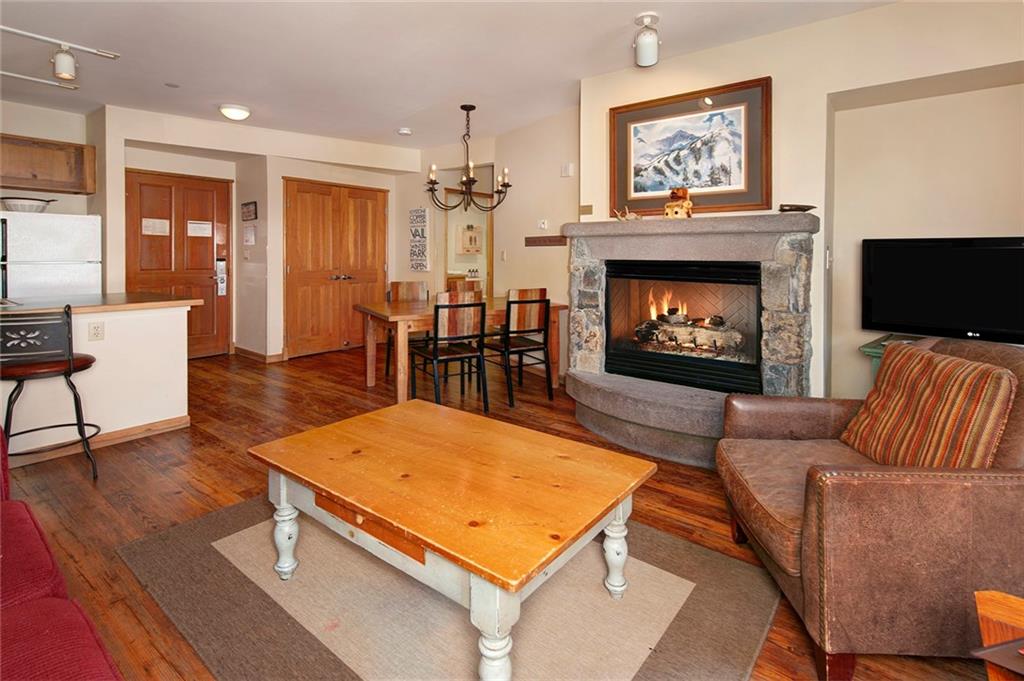 129 River Run Road, Unit 8058 Keystone, CO 80435 - Photo 13 of 35 a living room with furniture a flat screen tv and a fireplace