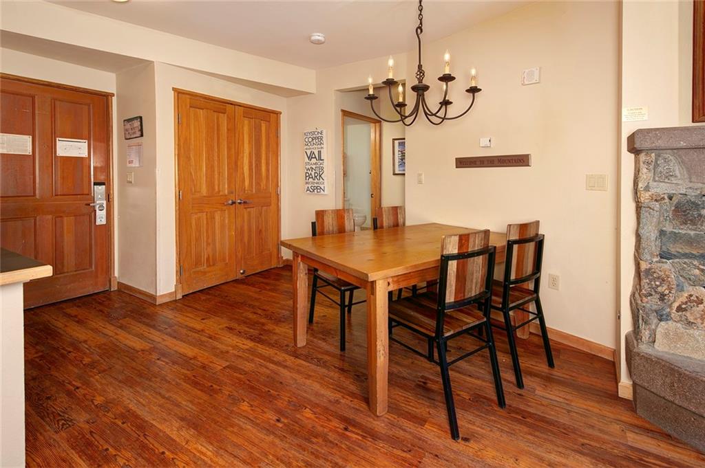 129 River Run Road, Unit 8058 Keystone, CO 80435 - Photo 14 of 35 a view of a dining room with furniture and wooden floor