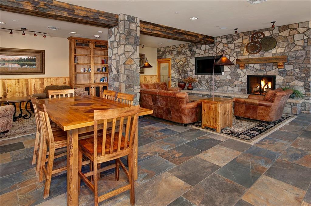 129 River Run Road, Unit 8058 Keystone, CO 80435 - Photo 21 of 35 a kitchen with stainless steel appliances granite countertop a stove a sink and a microwave